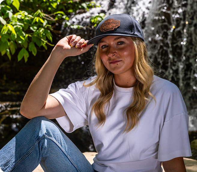 Woman wearing cap in forest